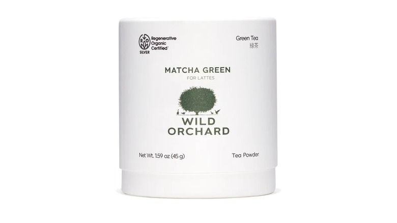 Container of Wild Orchard green matcha with tree logo on front