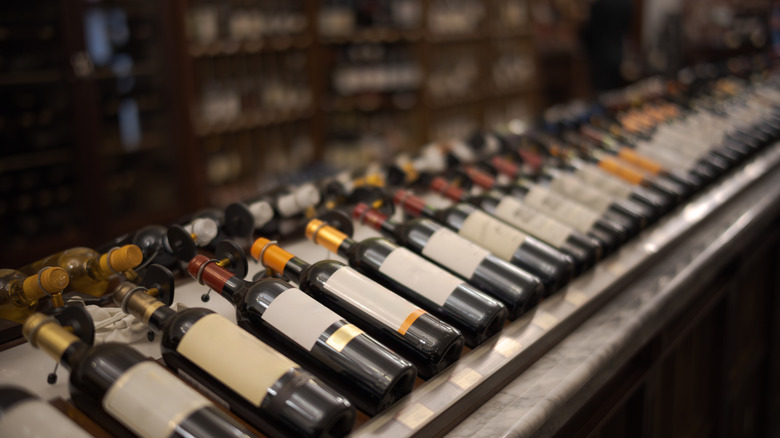 Bottles of red wine laying in a wine rack