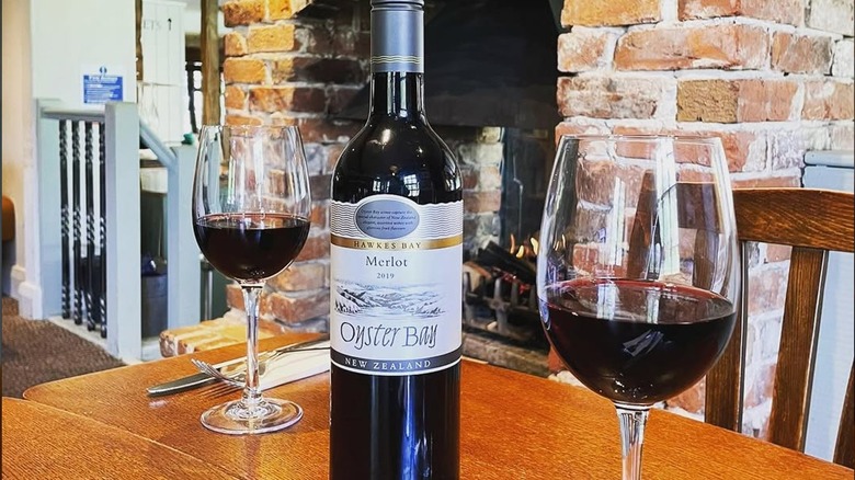 Bottle and glasses of Oyster Bay merlot