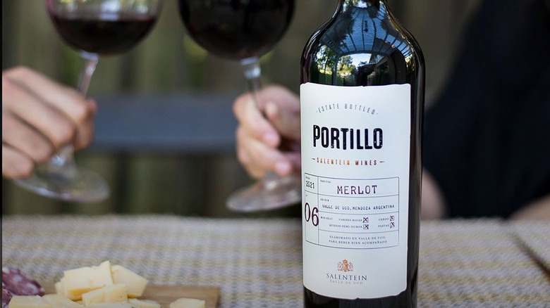 Bottle and glasses of Portillo merlot