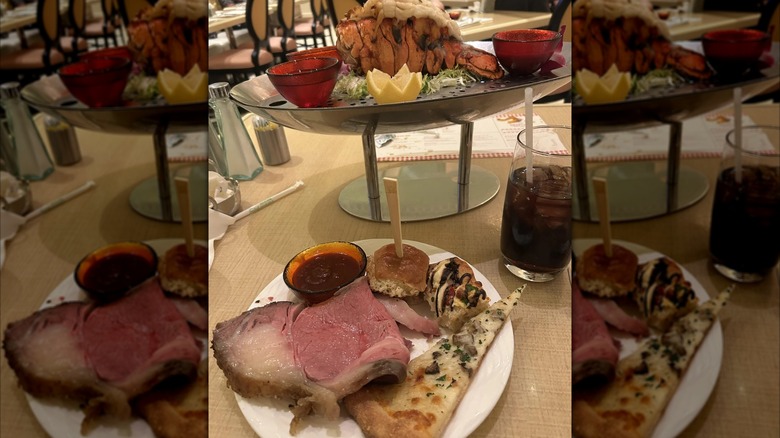Prime rib with pizza, dipping sauce, and lobster tail