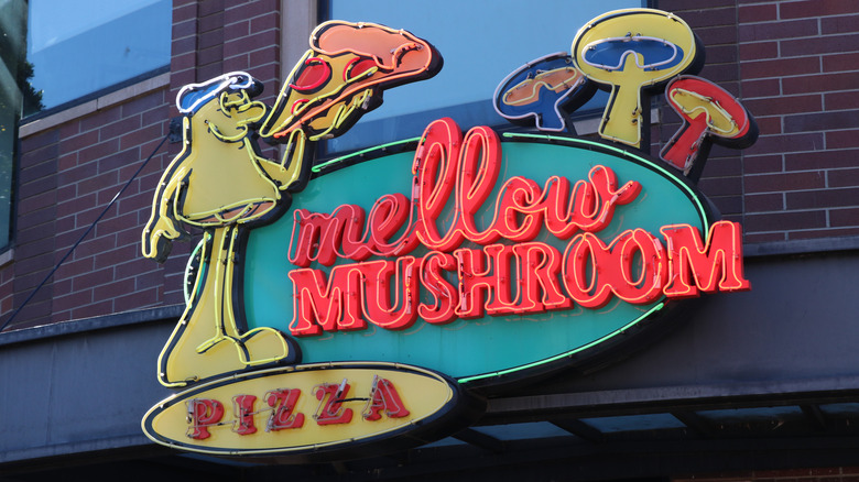 Mellow Mushroom neon sign on building