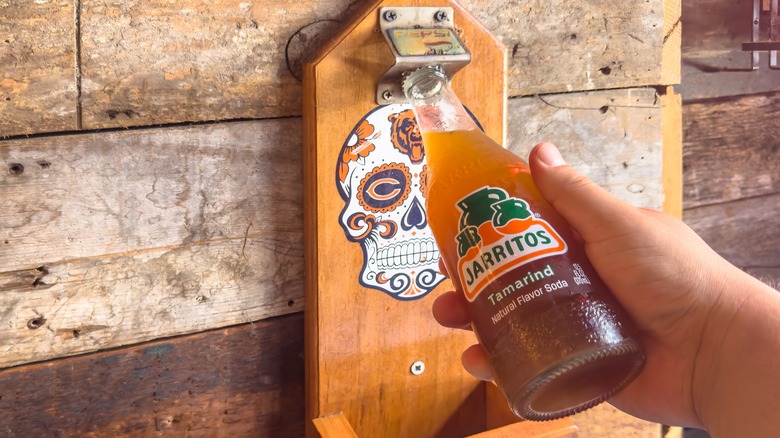Jarritos tamarind soda being opened