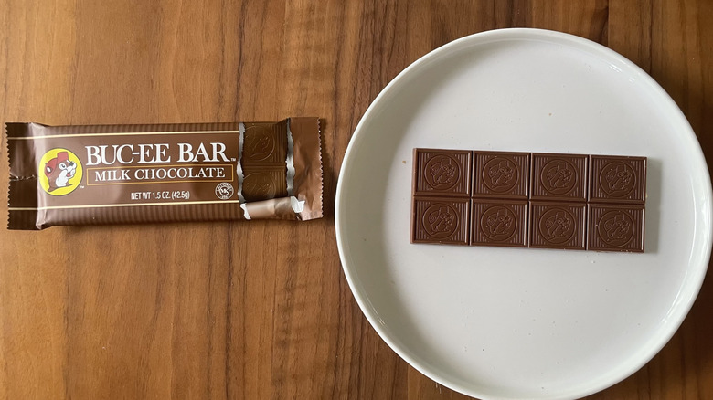 Buc-ee's milk chocolate bar on a plate and with packaging