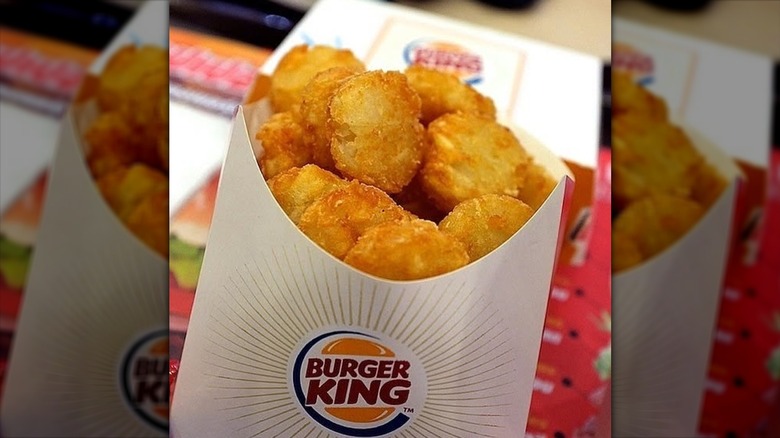 Burger King hash browns in a cardboard sleeve