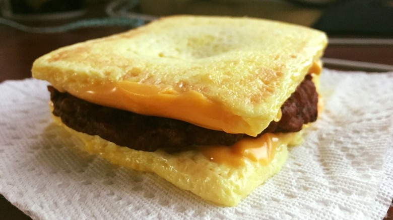 Burger King sausage and cheese breakfast sandwich with bread buns replaced by egg patties