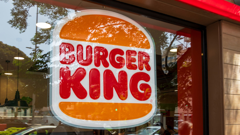 Burger King logo is prominently displayed on a restaurant window