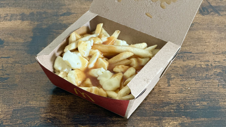 Cardboard box from McDonald's filled with poutine