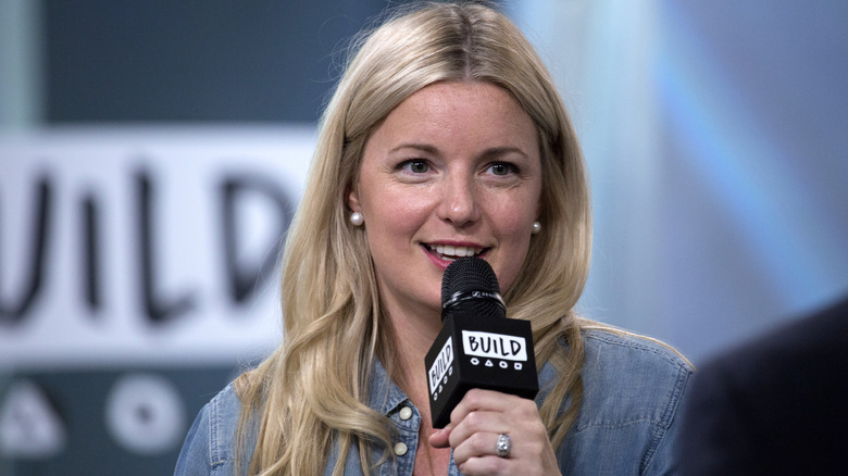 Damaris Phillips speaking into a microphone at an event