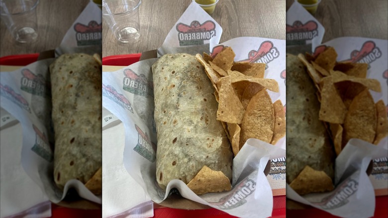 Mirrored image of Sombrero burrito with chips on tray