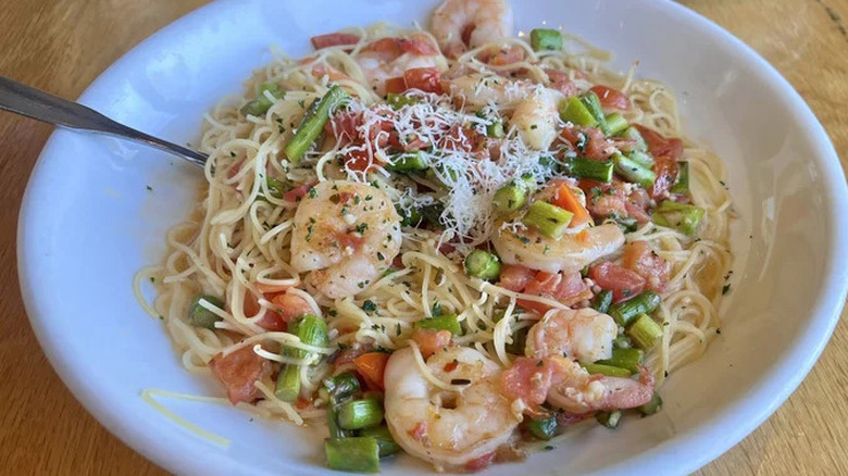 Olive Garden's shrimp scampi pasta dish served in a white bowl