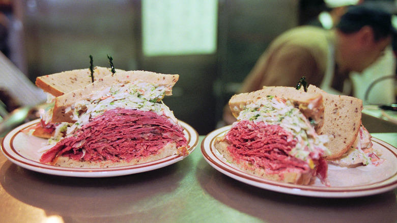 Two plates with corned beef sandwiches