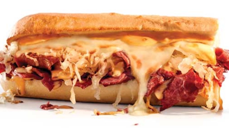 A sub sandwich with oozing melted cheese