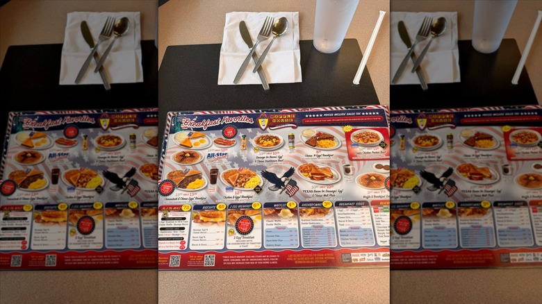 Waffle Houes menu on table with utensils and drink