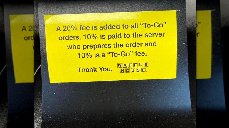 Yellow sign about added to-go fees at Waffle House