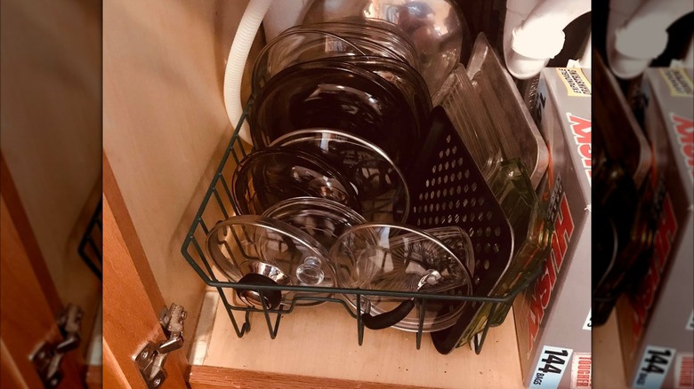 Pot and pan lids stored in a dish rack