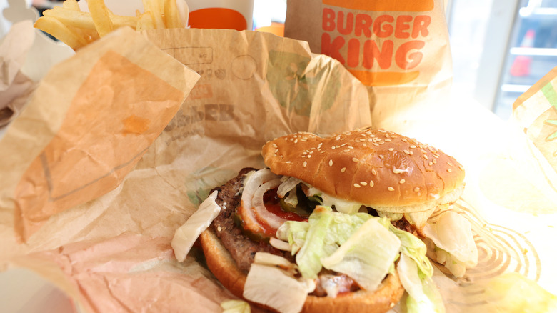 A messy burger on Burger King packaging