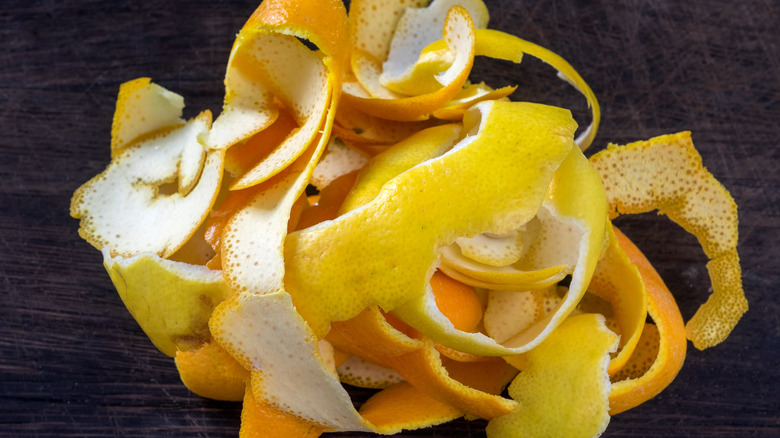 Tangle of citrus peels on wooden table