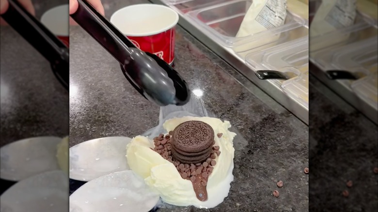 Employee mixing the add-ins at Cold Stone