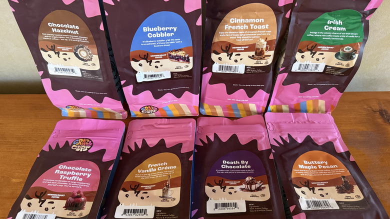 Eight bags of coffee on wooden table