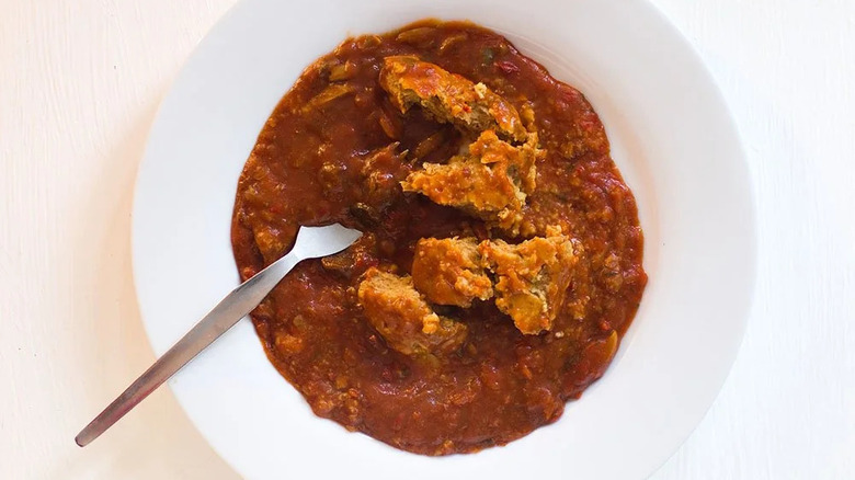 country captain curry with fork in white bowl