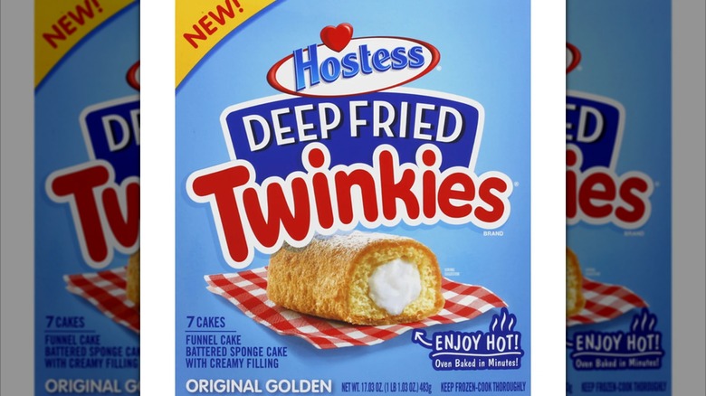Packaging for Hostess frozen deep-fried Twinkies showing a fried twinkie on a gingham-patterned napkin over a blue backdrop