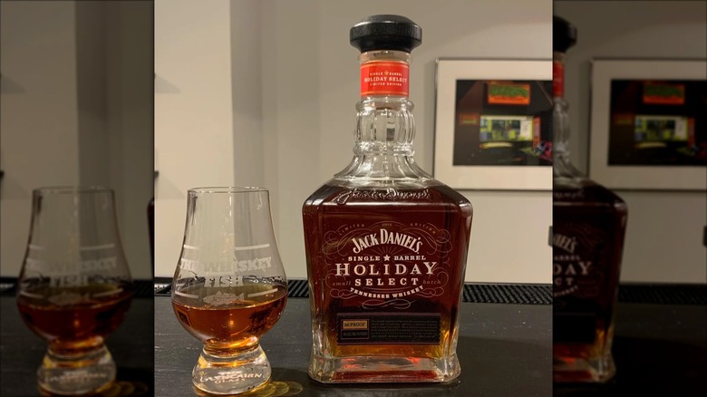 Bottle of Jack Daniel's Holiday Select Series with glass