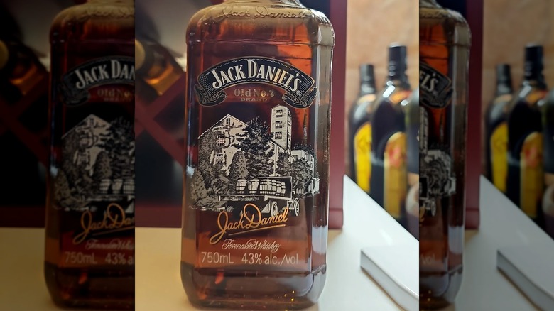 Bottle from Jack Daniel's Scenes from Lynchburg collection featuring distillery and barrels on a truck