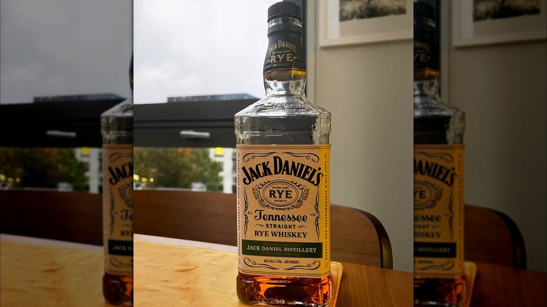 Bottle of Jack Daniel's Tennessee Straight Rye on wooden table
