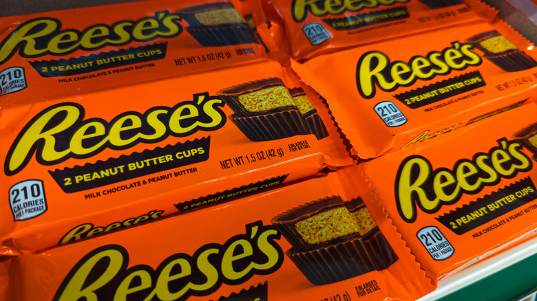 Rows of Reese's peanut butter cups on a shelf.