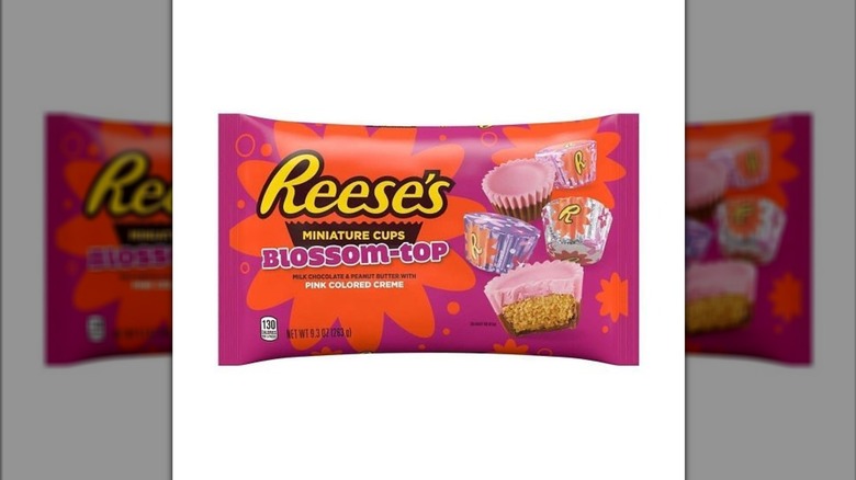 A pink and orange package of Reese's Miniature Cups Blossom-Tops, showing an image of the pink-and-brown candies.