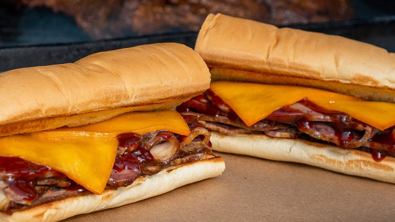 Close up of two Pit-smoked brisket Subway sandwiches