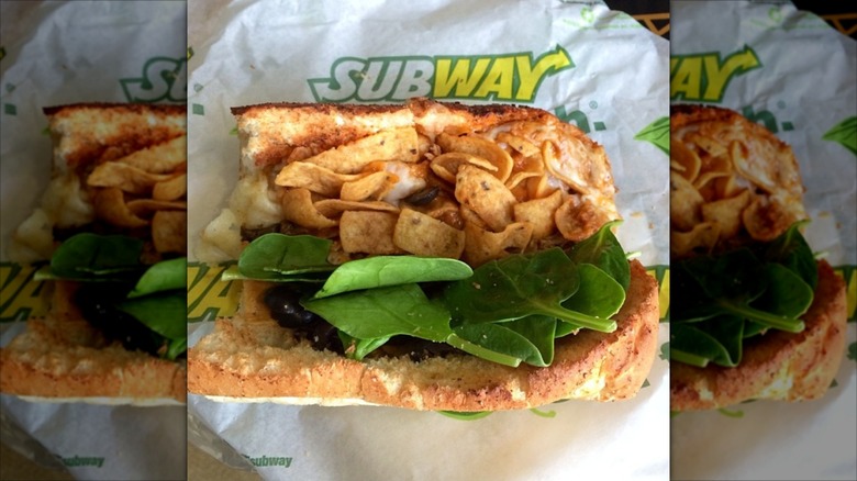 Mirrored image of open six inch Fritos Enchilada Melt sandwich on Subway packaging