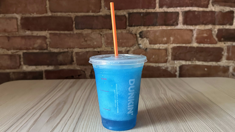 Dunkin' Blue Raspberry Coolatta on wooden table