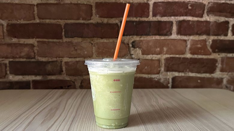 Dunkin' Frozen Matcha Latte on wooden table