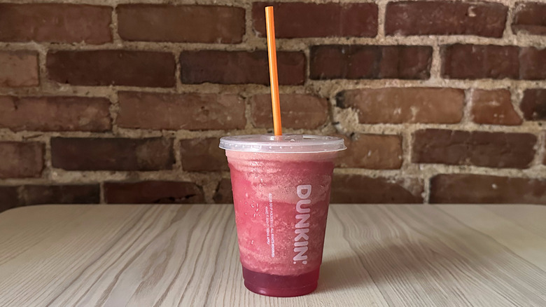 Dunkin' Strawberry Coolatta on wooden table