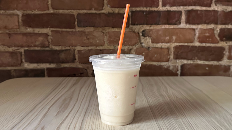 Dunkin' Vanilla Bean Coolatta on wooden table