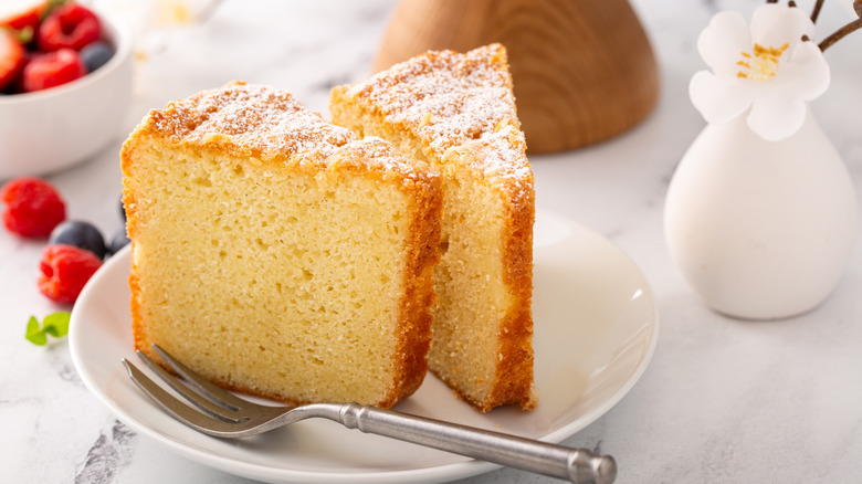 simple vanilla cake slices on plate with berries