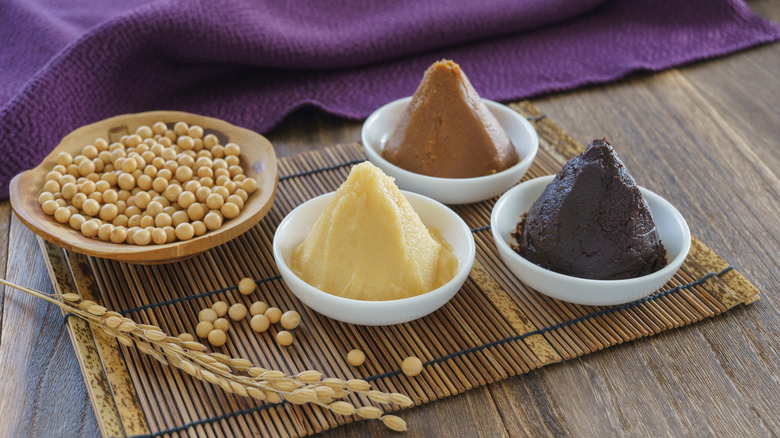 different types of miso and soybeans in bowls
