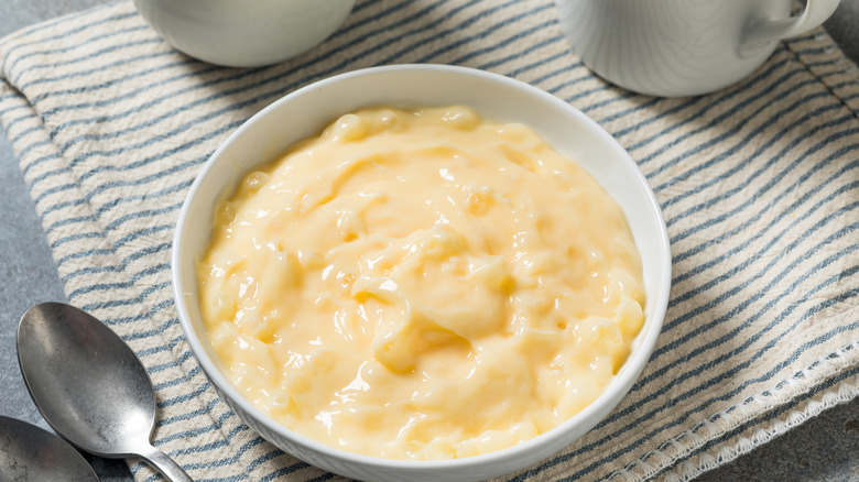 A tub of tapioca pudding sitting on a countertop.