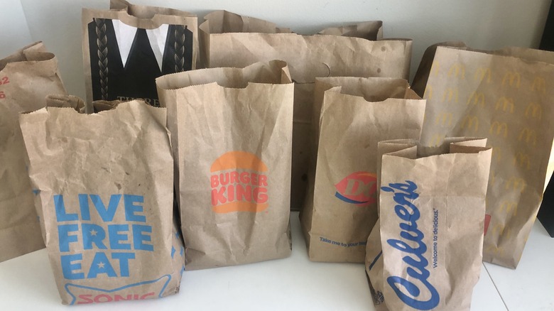 Fast-food to-go bags with bacon cheeseburgers