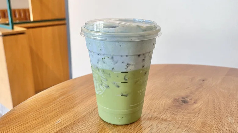 Starbucks Iced Blue Coconut Matcha drink in a to-go cup.