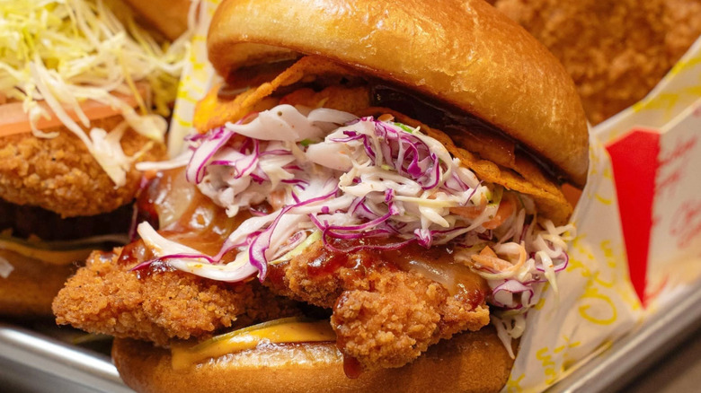 Several chicken menu items from Chicken Guy! on a tray