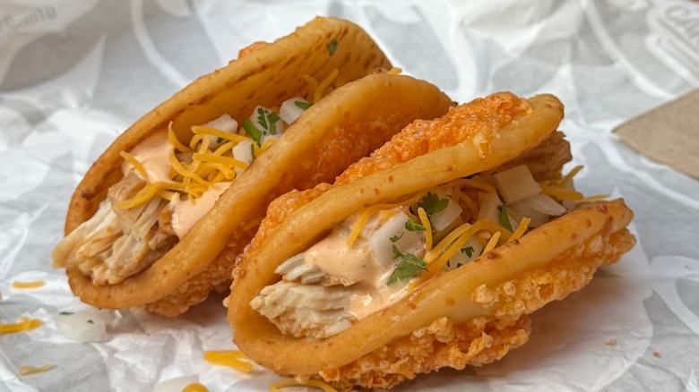 Two Taco Bell chicken cheddar chalupas.