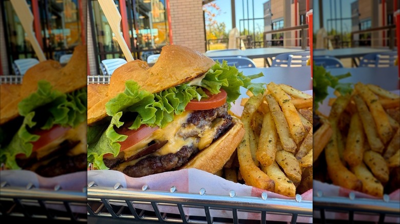 a Smashburger and fries on a table