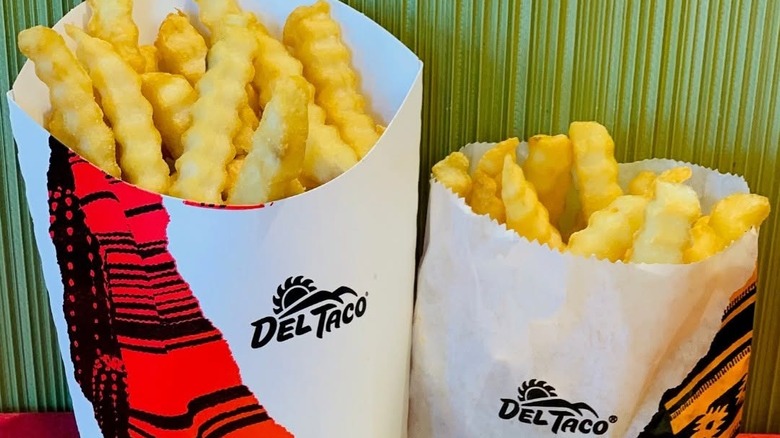 A regular and large size of crinkle cut fries from Del Taco