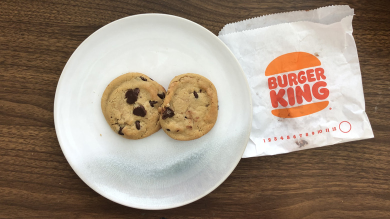 Two Burger King chocolate chip cookies.