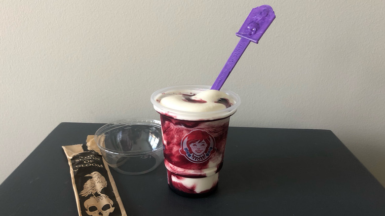Wendy's Raven's Blood Frosty with purple spoon.
