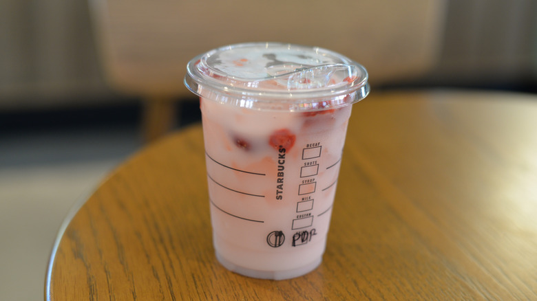 starbucks pink drink on a wooden table