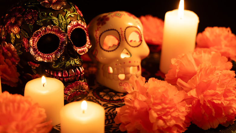Skulls, candles, and flowers on the ofrenda